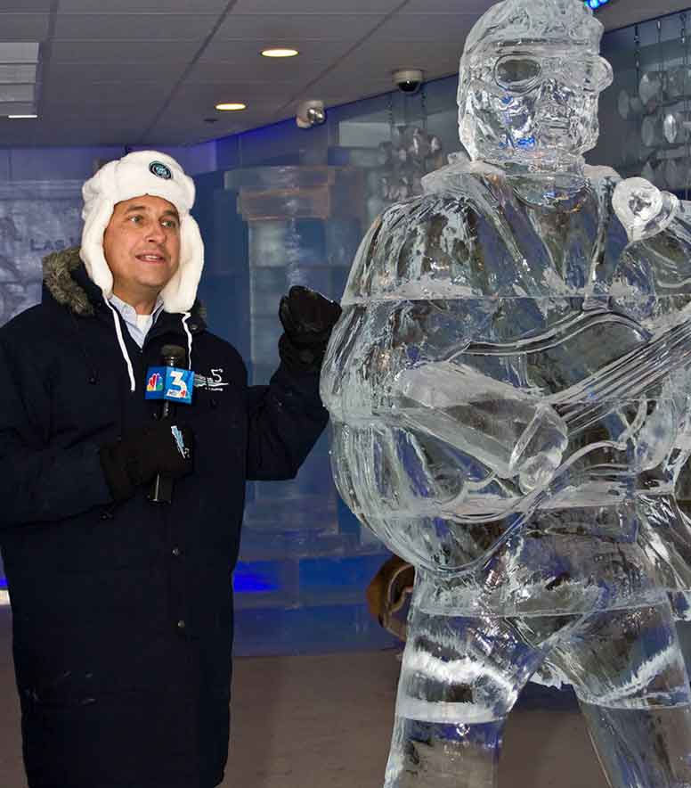 Newscaster with ice sculpture