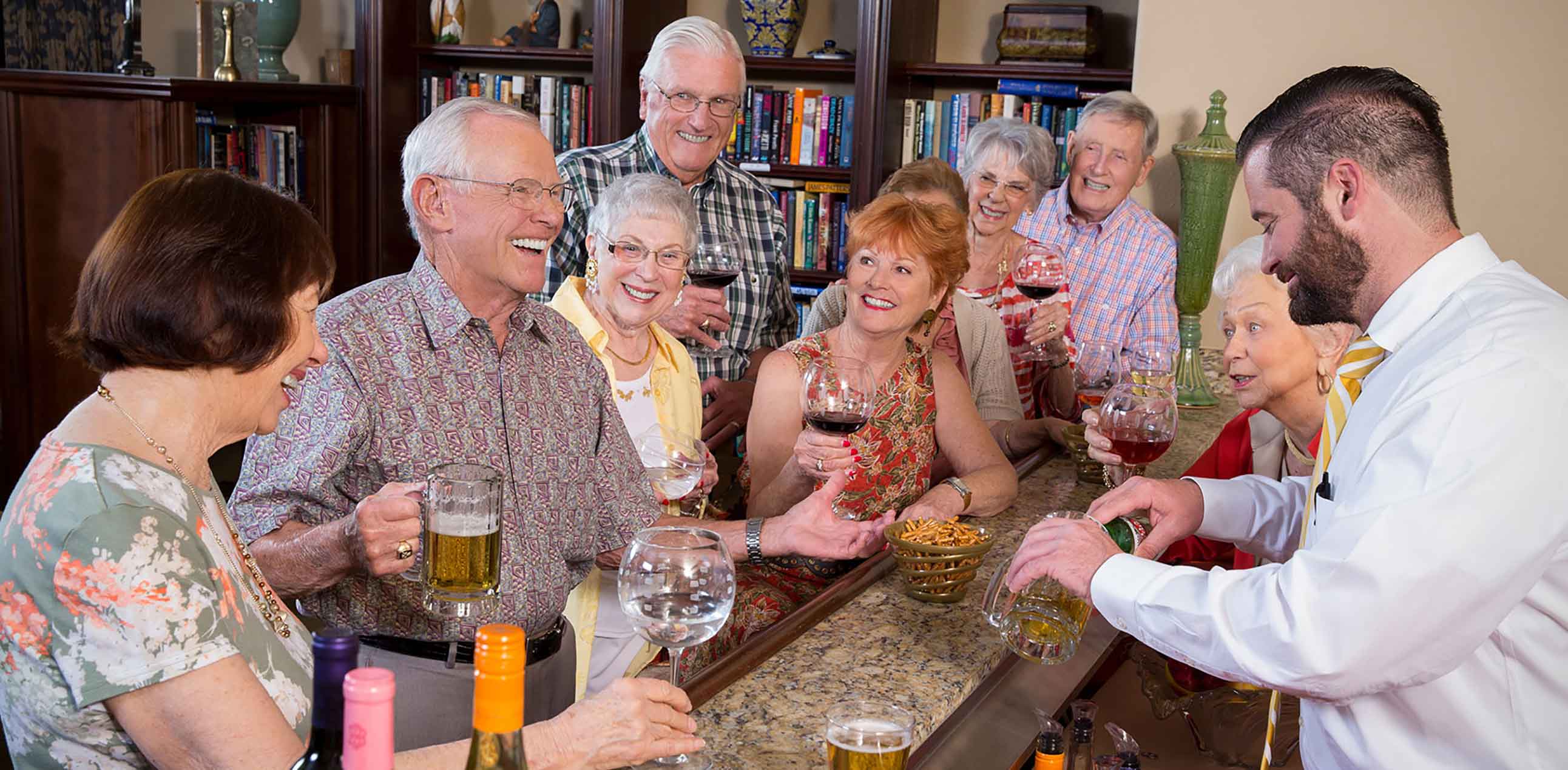 Senior citizens socializing at the bar