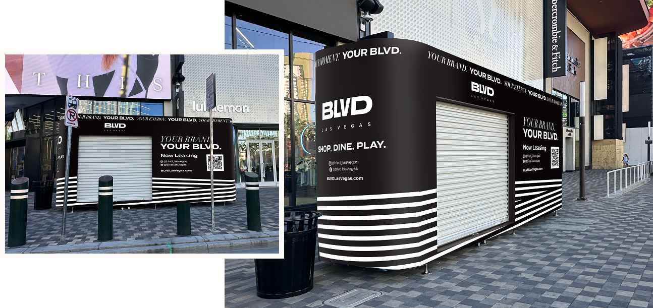 Black and white kiosk with YOUR BLVD. branding, closed shutters, and leasing information on a city sidewalk.
