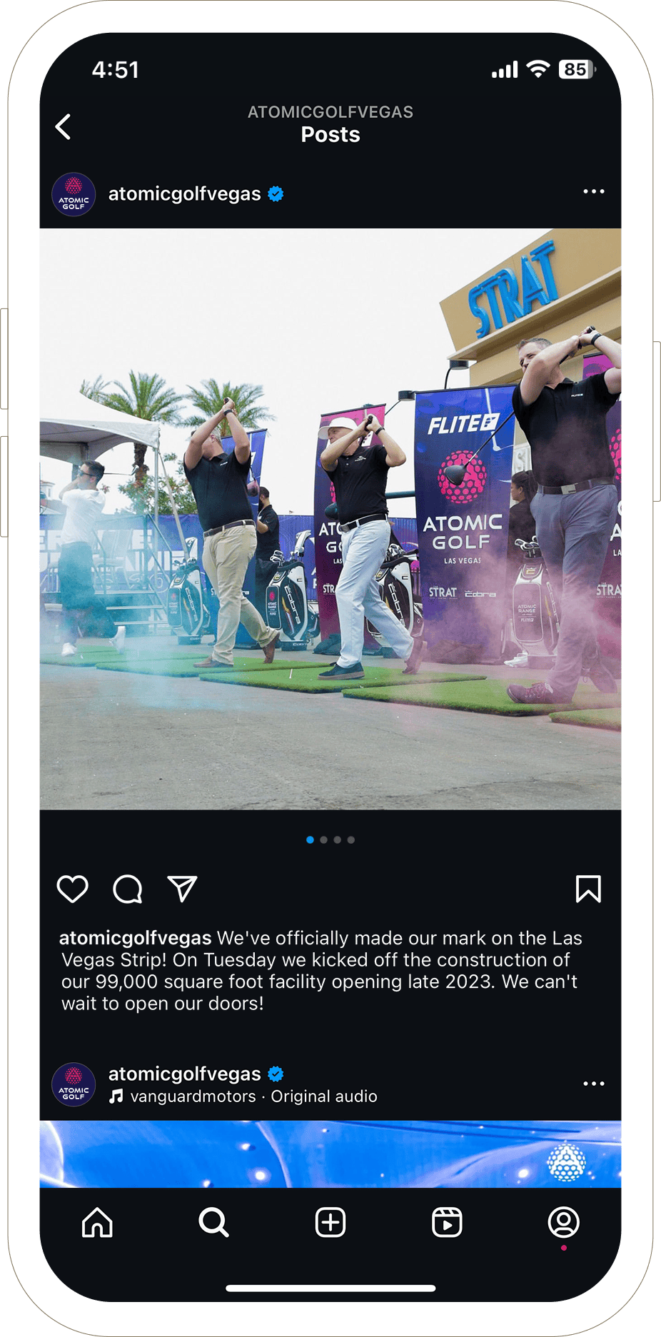 Four people swing golf clubs at an outdoor event, with colorful smoke and The STRAT hotel in the background.
