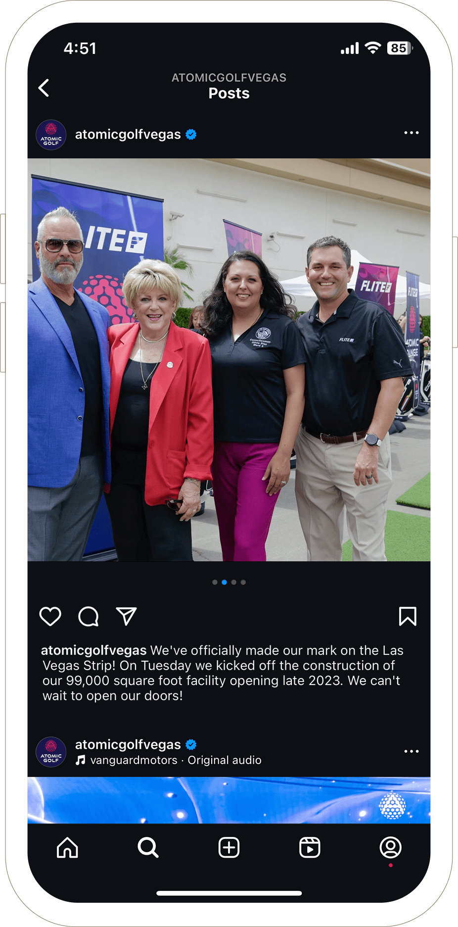 Four people pose and smile outdoors at a golf event in Las Vegas, standing in front of event banners.