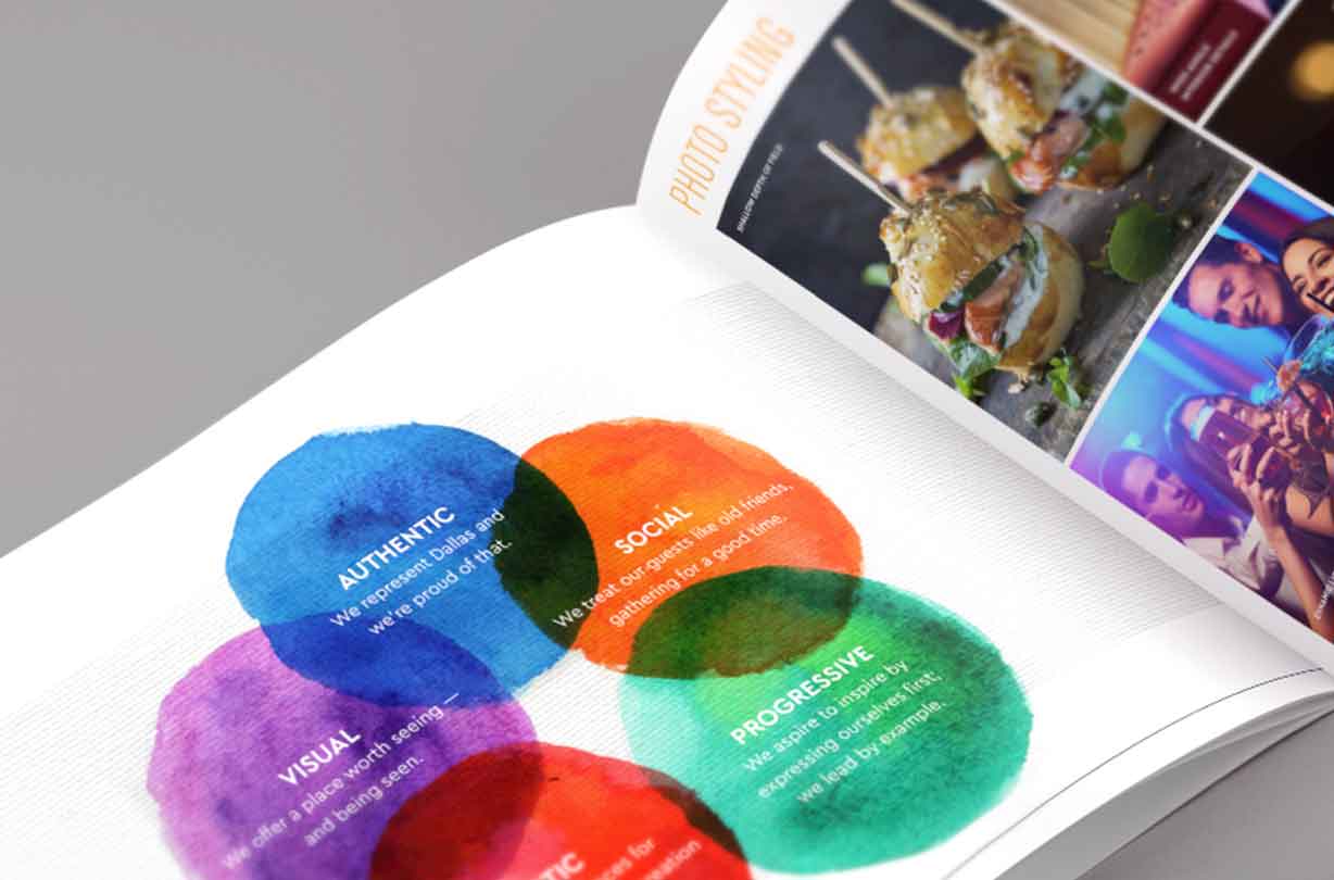 Open magazine showing colorful overlapping circles with text and a page of styled food photos at the top right.