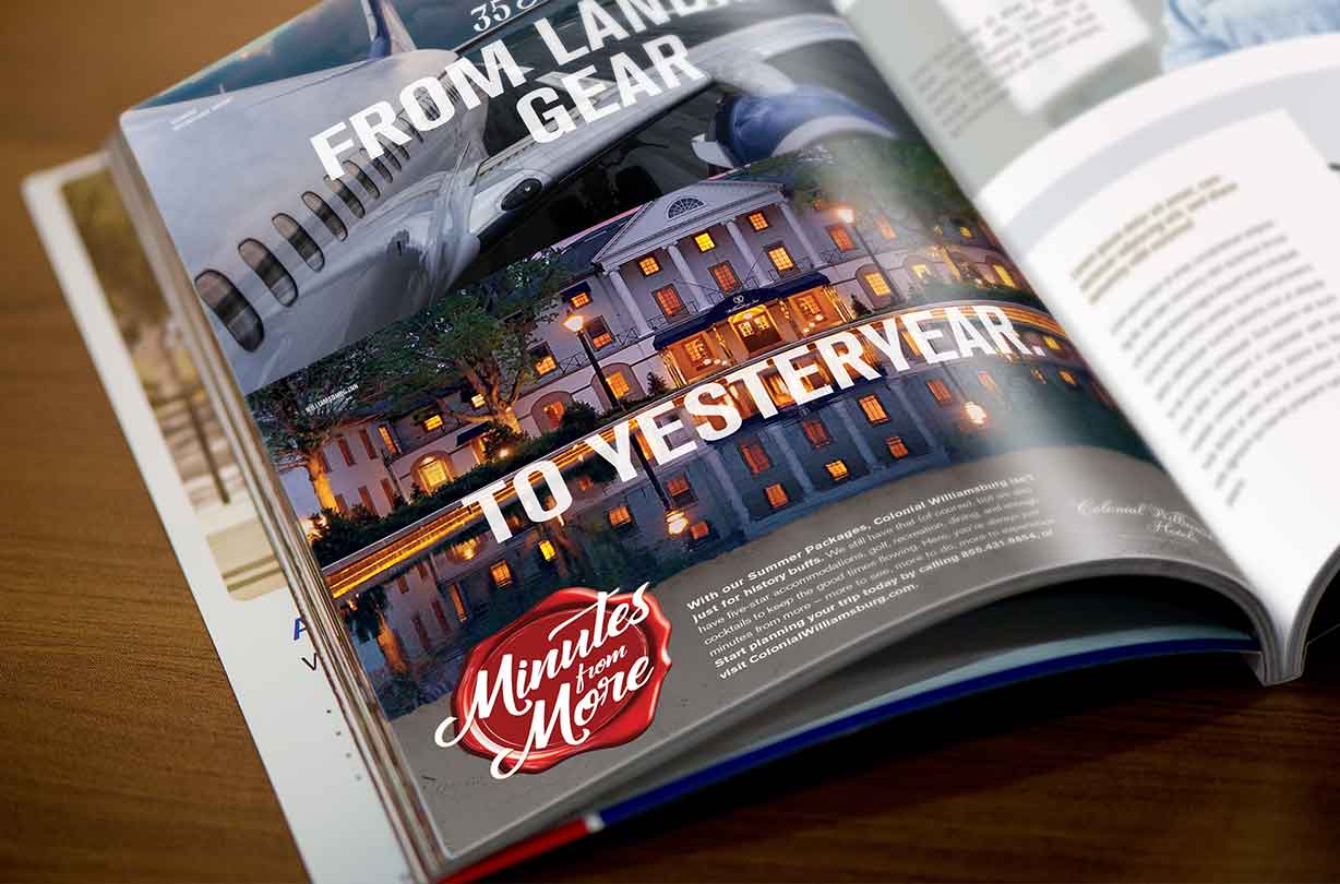 Open magazine showing an ad with a plane, a historic building, and the text From Landing Gear to Yesteryear.