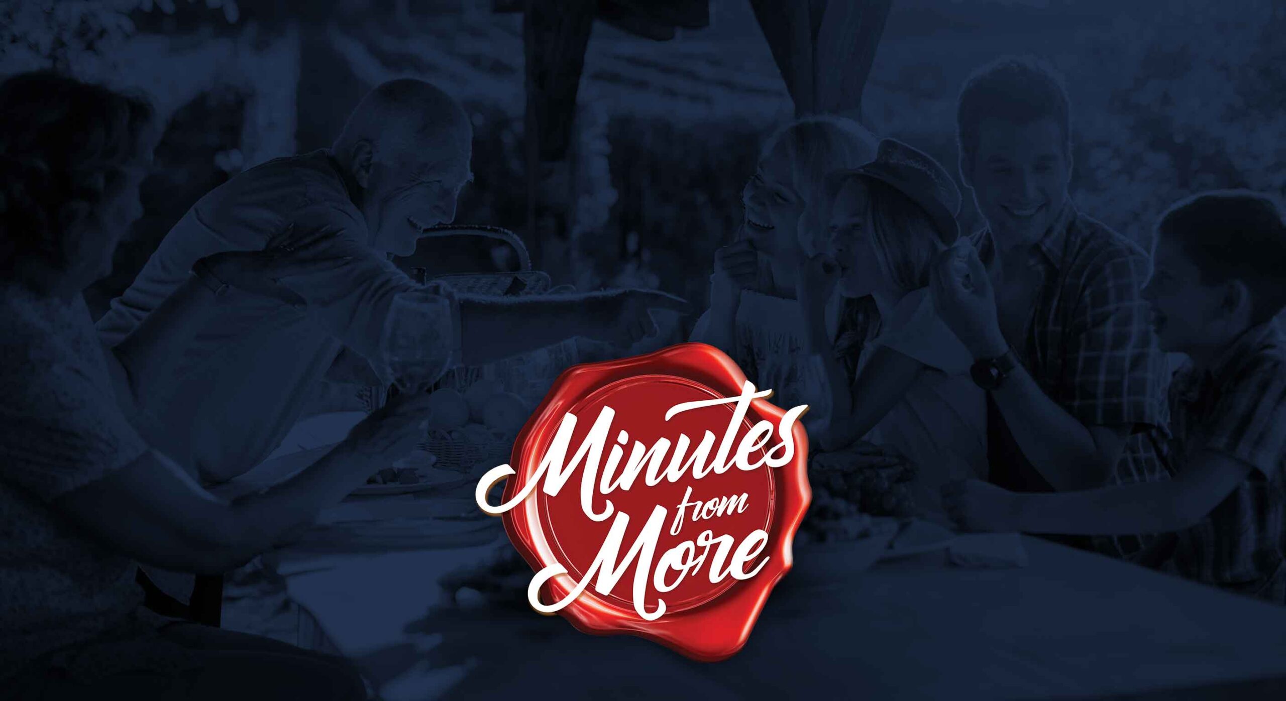 A family laughs and shares a meal outdoors with Minutes from More written in bold script across the image.