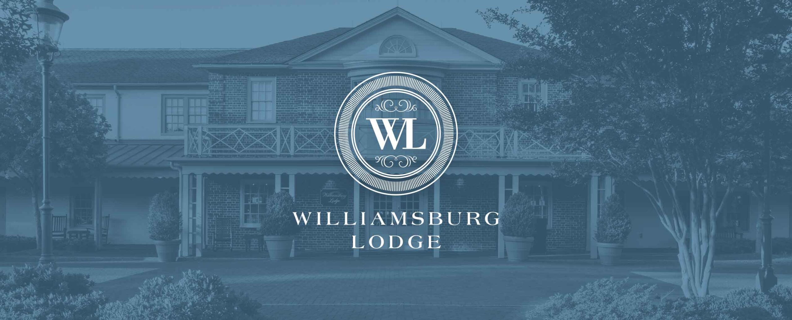 Williamsburg Lodge building exterior with WL logo and text overlay reading Williamsburg Lodge.