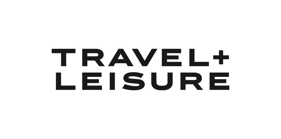 Black text TRAVEL + LEISURE in bold, uppercase letters on a light gray background.