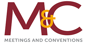 M&C logo with the text MEETINGS AND CONVENTIONS in capital letters below.