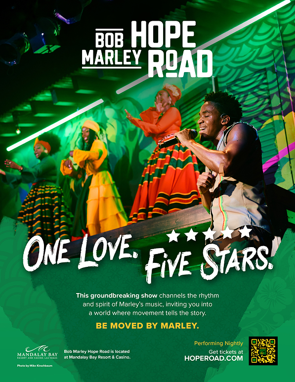 Performers dance and sing on stage in vibrant costumes for the Bob Marley Hope Road show.
